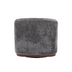 Un fauteuil de relaxation pivotant en tissu chenille, doté d'une assise confortable et d'une base robuste.